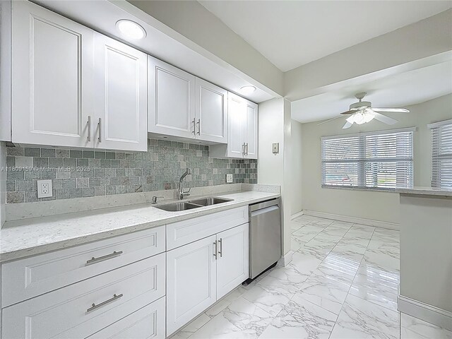 1100 SW 130th Ave Unit 111H, Pembroke Pines, FL 33027 - kitchen featuring stainless steel dishwasher, a sink, light marble finish floors, ceiling fan, and white cabinets