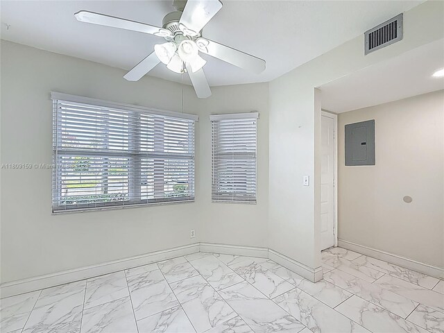 1100 SW 130th Ave Unit 111H, Pembroke Pines, FL 33027 - empty room with electric panel, light marble finish flooring, baseboards, and ceiling fan