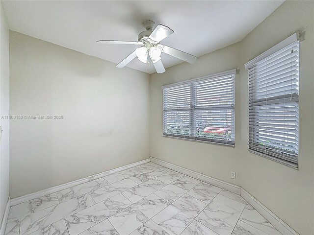 1100 SW 130th Ave Unit 111H, Pembroke Pines, FL 33027 - unfurnished room featuring baseboards, light marble finish flooring, and ceiling fan