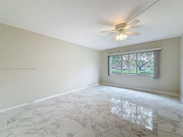 1100 SW 130th Ave Unit 111H, Pembroke Pines, FL 33027 - empty room with baseboards, a ceiling fan, and light marble finish floors