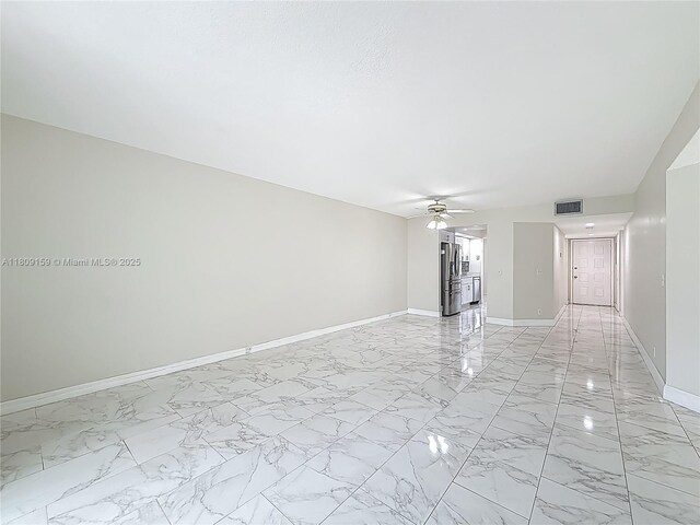 1100 SW 130th Ave Unit 111H, Pembroke Pines, FL 33027 - unfurnished room with ceiling fan, baseboards, and light marble finish floors