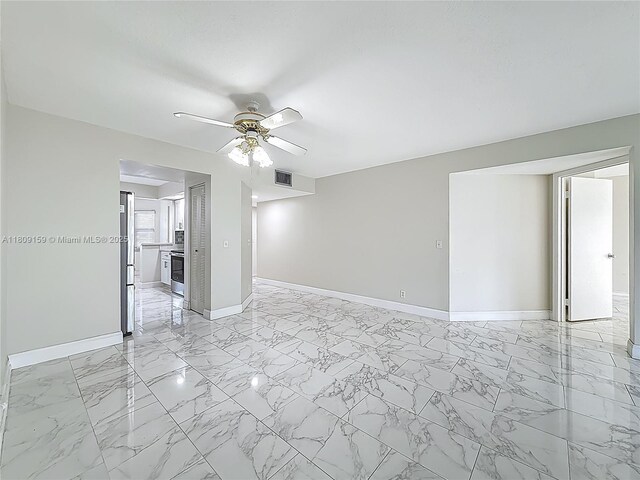 1100 SW 130th Ave Unit 111H, Pembroke Pines, FL 33027 - spare room featuring baseboards, a ceiling fan, and light marble finish flooring
