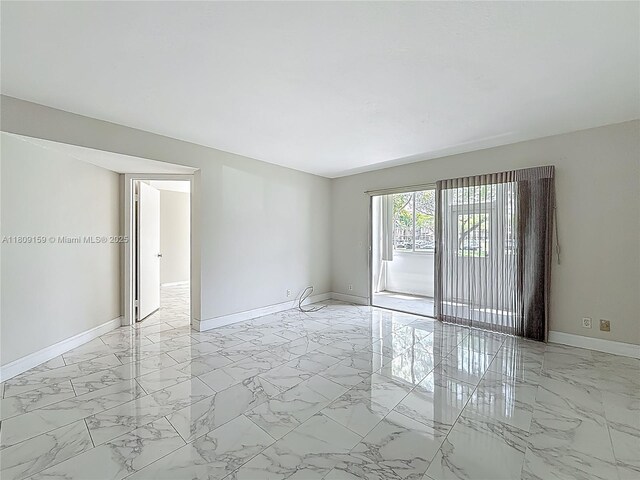 1100 SW 130th Ave Unit 111H, Pembroke Pines, FL 33027 - unfurnished room with baseboards and light marble finish floors
