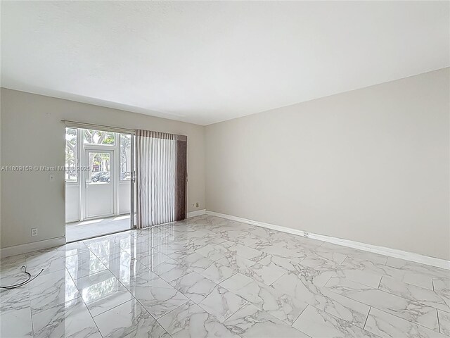 1100 SW 130th Ave Unit 111H, Pembroke Pines, FL 33027 - unfurnished room with light marble finish floors and baseboards
