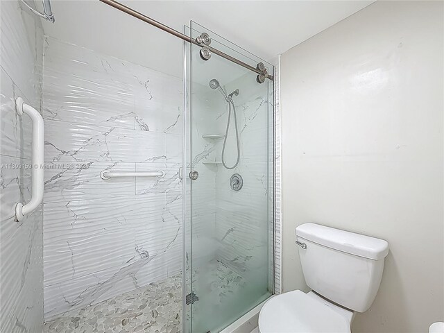 1100 SW 130th Ave Unit 111H, Pembroke Pines, FL 33027 - full bath with toilet and a stall shower