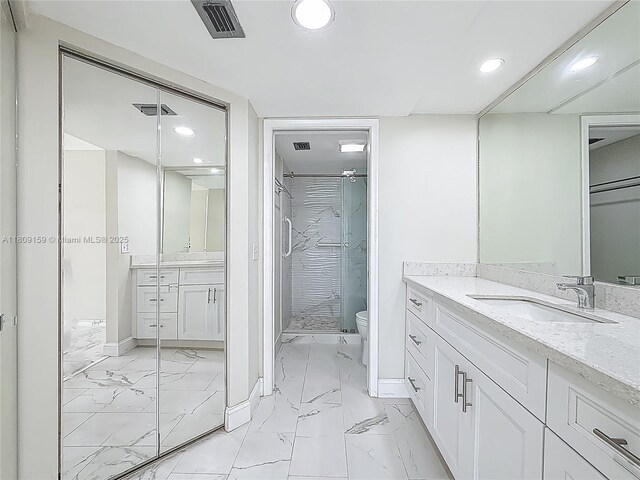 1100 SW 130th Ave Unit 111H, Pembroke Pines, FL 33027 - bathroom with marble look tiles, recessed lighting, vanity, a shower stall, and baseboards