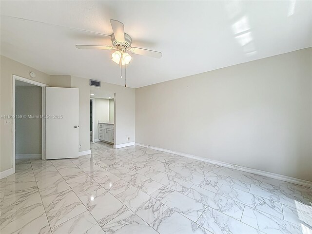 1100 SW 130th Ave Unit 111H, Pembroke Pines, FL 33027 - unfurnished bedroom featuring baseboards, light marble finish floors, and ceiling fan