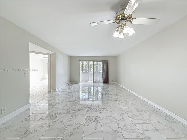 1100 SW 130th Ave Unit 111H, Pembroke Pines, FL 33027 - empty room with light marble finish floors, ceiling fan, and baseboards
