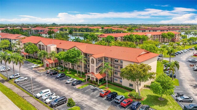 1100 SW 130th Ave Unit 111H, Pembroke Pines, FL 33027 - drone / aerial view of a nearby body of water and apartment complex