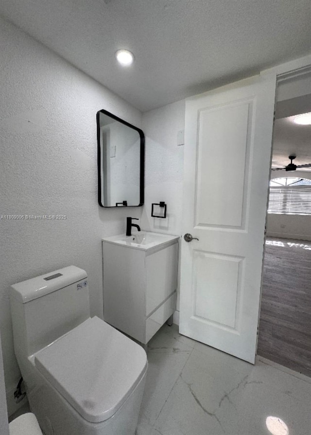 12455 SW 187th Ter, Miami, FL 33177 - half bath with toilet, marble look tiles, vanity, and recessed lighting