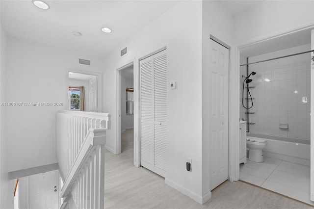 8206 SW 29th St Unit 104, Miramar, FL 33025 - corridor with an upstairs landing, baseboards, and recessed lighting