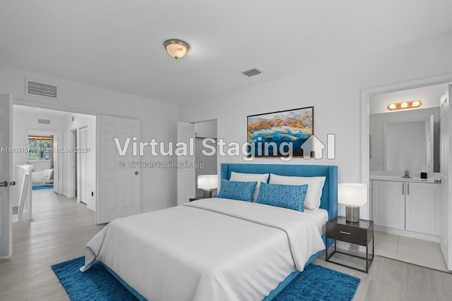 8206 SW 29th St Unit 104, Miramar, FL 33025 - bedroom with light wood-style floors and a sink