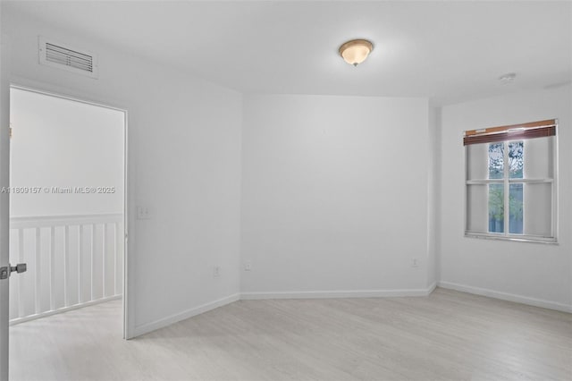 8206 SW 29th St Unit 104, Miramar, FL 33025 - spare room with wood finished floors, baseboards, and a smoke detector