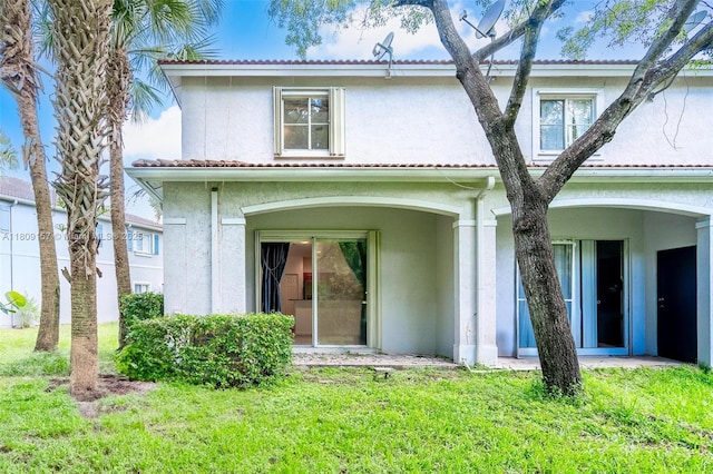 8206 SW 29th St Unit 104, Miramar, FL 33025 - back of property with stucco siding and a yard
