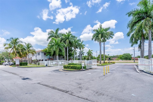 8206 SW 29th St Unit 104, Miramar, FL 33025 - view of asphalt street with curbs, a gated entry, and a gate