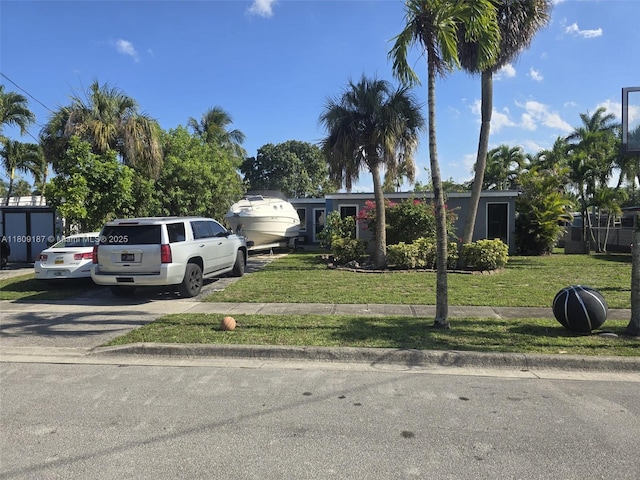 5812 NW 20th Ct, Margate, FL 33063 - obstructed view of property featuring a front yard