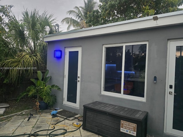 5812 NW 20th Ct, Margate, FL 33063 - doorway to property with a patio and stucco siding
