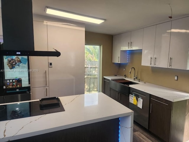 5812 NW 20th Ct, Margate, FL 33063 - kitchen featuring dishwasher, a sink, black electric cooktop, and light stone counters