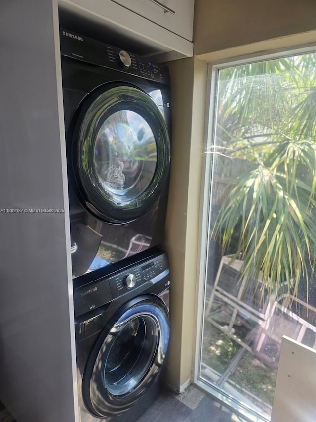 5812 NW 20th Ct, Margate, FL 33063 - laundry room featuring estacked washer and dryer
