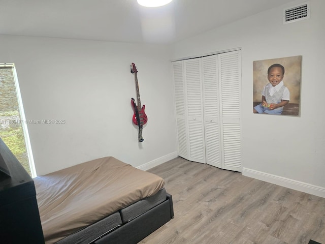 5812 NW 20th Ct, Margate, FL 33063 - bedroom with wood finished floors, baseboards, and a closet