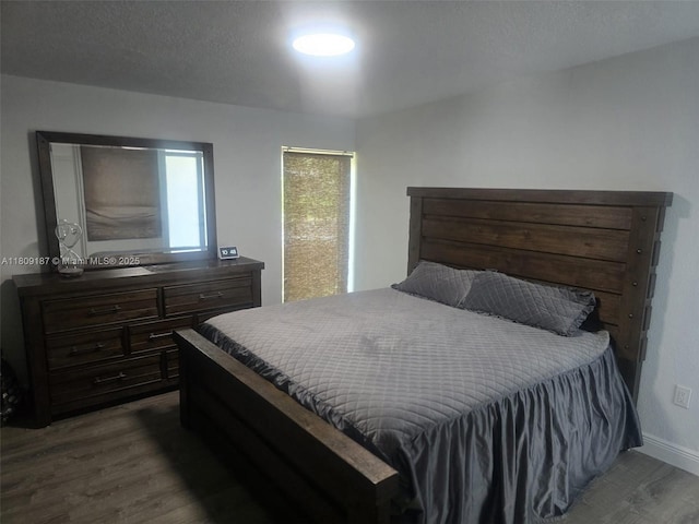 5812 NW 20th Ct, Margate, FL 33063 - bedroom featuring wood finished floors and baseboards