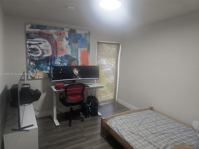 5812 NW 20th Ct, Margate, FL 33063 - bedroom featuring wood finished floors, baseboards, and a desk