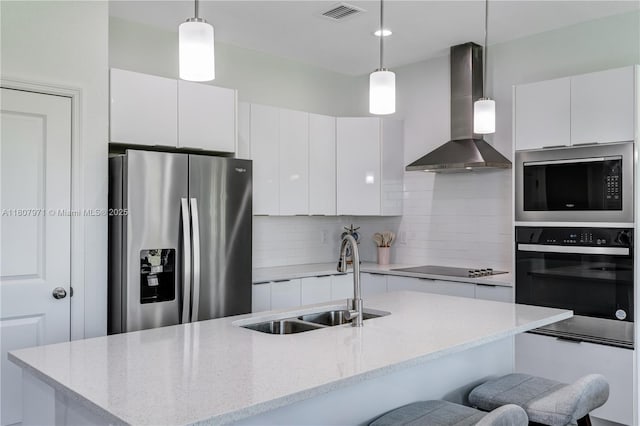 2013 Inglewood Cir, La Belle, FL 33935 - kitchen with black appliances, wall chimney exhaust hood, a sink, tasteful backsplash, and modern cabinets