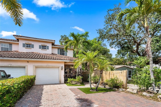 849 SW 11th Ct, Fort Lauderdale, FL 33315 - view of front facade with stucco siding, decorative driveway, and a tiled roof