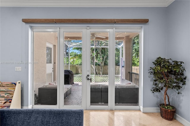 849 SW 11th Ct, Fort Lauderdale, FL 33315 - entryway with french doors, tile patterned flooring, baseboards, ornamental molding, and plenty of natural light