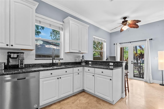 849 SW 11th Ct, Fort Lauderdale, FL 33315 - kitchen with stainless steel dishwasher, a sink, a peninsula, a ceiling fan, and decorative backsplash