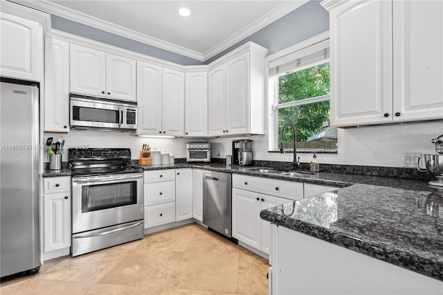 849 SW 11th Ct, Fort Lauderdale, FL 33315 - kitchen with stainless steel appliances, a sink, white cabinetry, backsplash, and ornamental molding