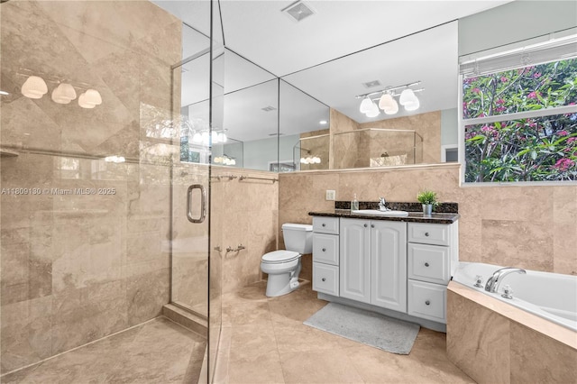 849 SW 11th Ct, Fort Lauderdale, FL 33315 - full bath featuring tile walls, vanity, a stall shower, toilet, and a garden tub