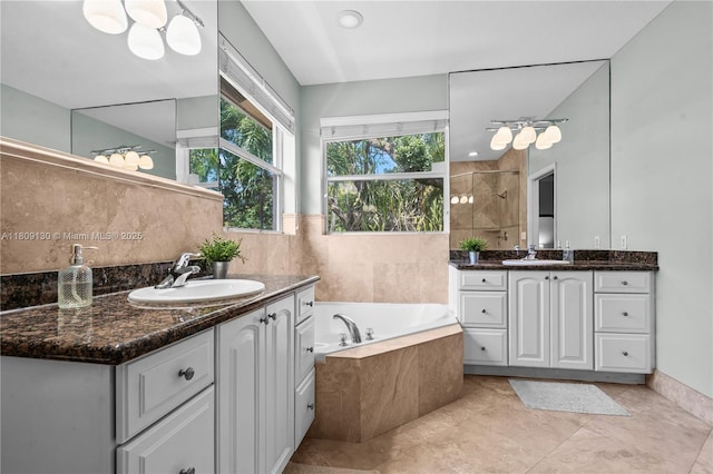 849 SW 11th Ct, Fort Lauderdale, FL 33315 - full bathroom with two vanities, tiled shower, a bath, and tile patterned flooring