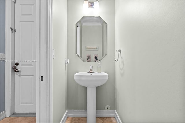 849 SW 11th Ct, Fort Lauderdale, FL 33315 - bathroom featuring baseboards and tile patterned floors