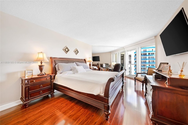16445 Collins Ave Unit 2226, Sunny Isles Beach, FL 33160 - bedroom featuring wood finished floors and a textured ceiling