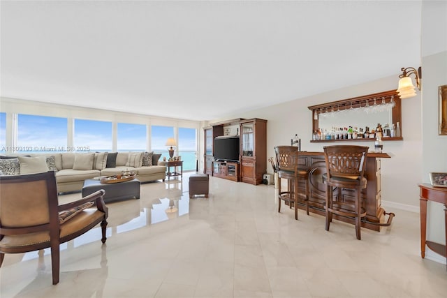 16445 Collins Ave Unit 2226, Sunny Isles Beach, FL 33160 - living area with a bar and baseboards