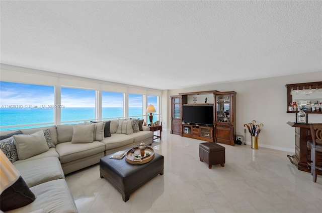 16445 Collins Ave Unit 2226, Sunny Isles Beach, FL 33160 - living room with a textured ceiling and a water view