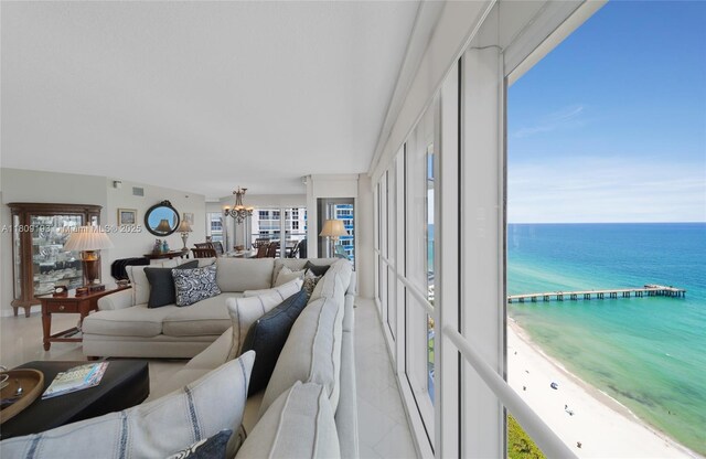 16445 Collins Ave Unit 2226, Sunny Isles Beach, FL 33160 - living room featuring a chandelier, a water view, and healthy amount of natural light