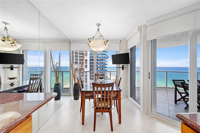 16445 Collins Ave Unit 2226, Sunny Isles Beach, FL 33160 - dining area with a textured ceiling and a chandelier
