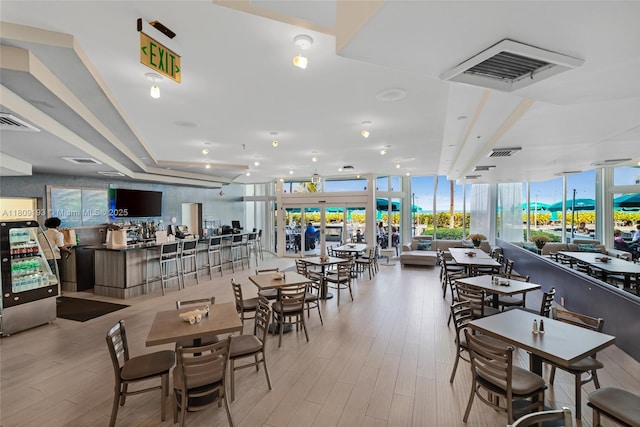 16445 Collins Ave Unit 2226, Sunny Isles Beach, FL 33160 - dining space with expansive windows and wood finished floors