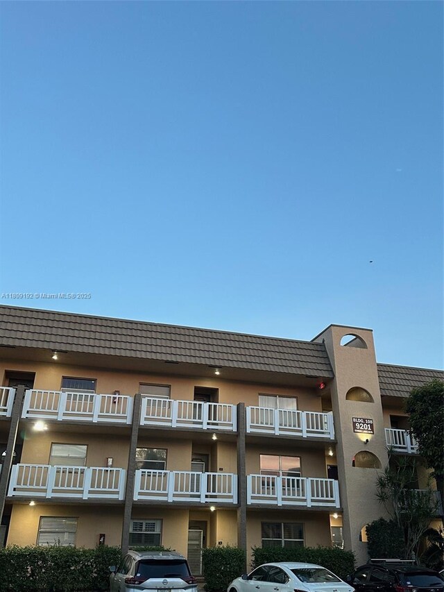 9201 Sunrise Lakes Blvd Unit 301, Sunrise, FL 33322 - view of apartment building / complex featuring uncovered parking