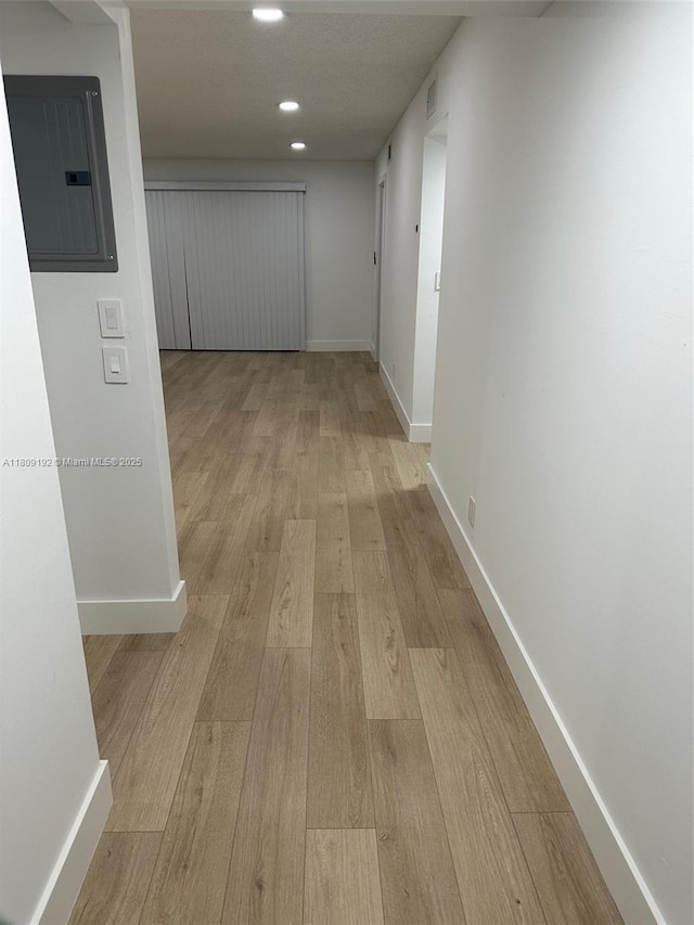 9201 Sunrise Lakes Blvd Unit 301, Sunrise, FL 33322 - hall with electric panel, light wood-style floors, baseboards, and recessed lighting