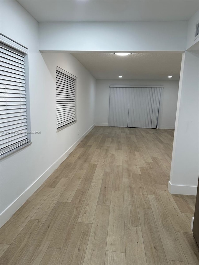 9201 Sunrise Lakes Blvd Unit 301, Sunrise, FL 33322 - empty room featuring light wood finished floors, baseboards, and recessed lighting