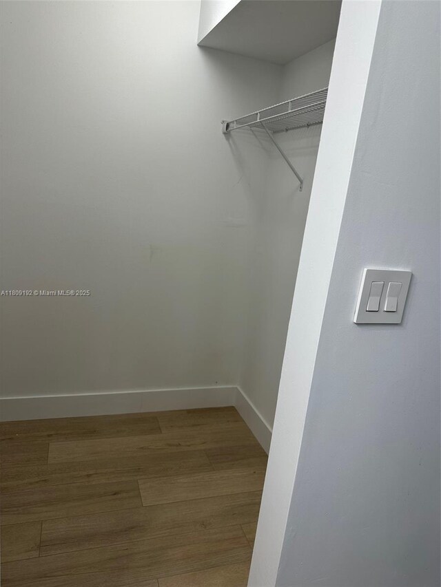 9201 Sunrise Lakes Blvd Unit 301, Sunrise, FL 33322 - walk in closet with wood finished floors
