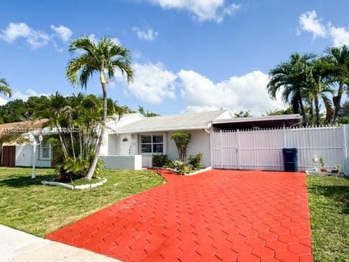 11321 SW 162nd Ter, Miami, FL 33157 - view of front of property featuring a gate and stucco siding