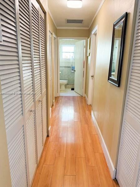 11321 SW 162nd Ter, Miami, FL 33157 - hallway with light wood finished floors, crown molding, and baseboards