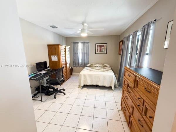 11321 SW 162nd Ter, Miami, FL 33157 - bedroom with a desk, light tile patterned floors, and a ceiling fan