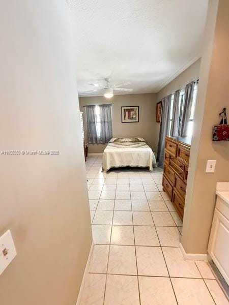 11321 SW 162nd Ter, Miami, FL 33157 - bedroom with light tile patterned floors, baseboards, and a ceiling fan