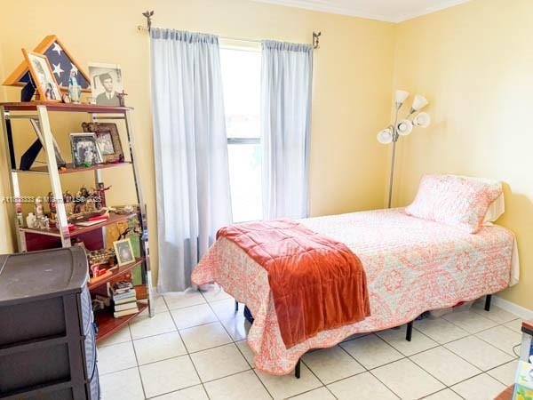 11321 SW 162nd Ter, Miami, FL 33157 - tiled bedroom featuring baseboards