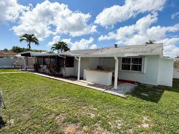 11321 SW 162nd Ter, Miami, FL 33157 - rear view of property featuring a sunroom